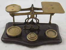 A set of brass postal scales and