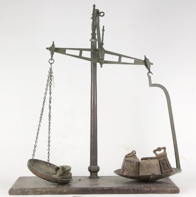 A set of brass scales and two house
