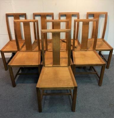 A set of eight oak dining chairs by