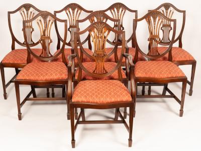 A set of eight shield back dining