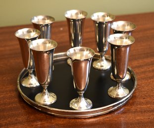 A set of eight sterling silver shot