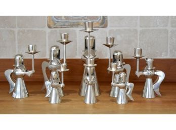 A set of eight tin angel form