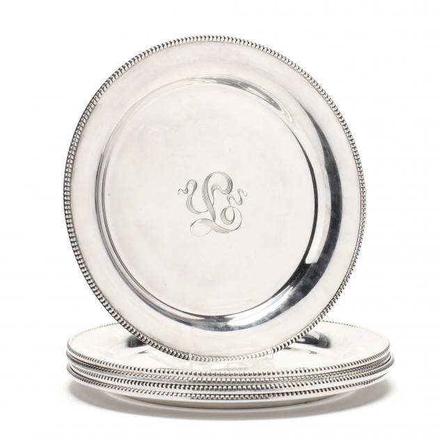 A SET OF FIVE STERLING SILVER BREAD