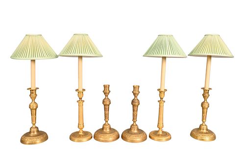 A SET OF FOUR CANDLESTICKS MADE