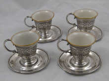 A set of four china tea cups with