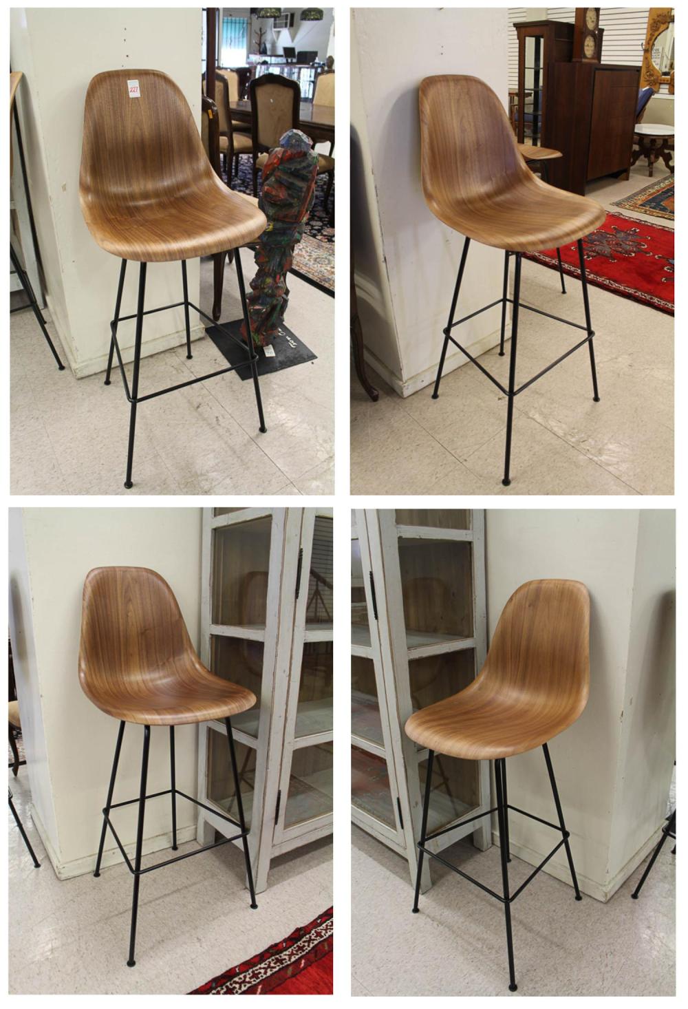 A SET OF FOUR EAMES BAR STOOLA