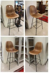 A SET OF FOUR EAMES BAR STOOLA