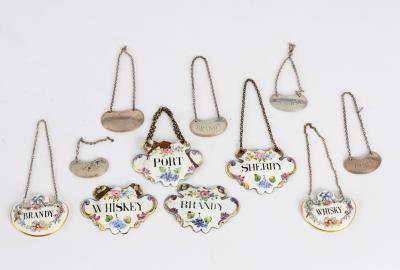 A set of four enamelled decanter