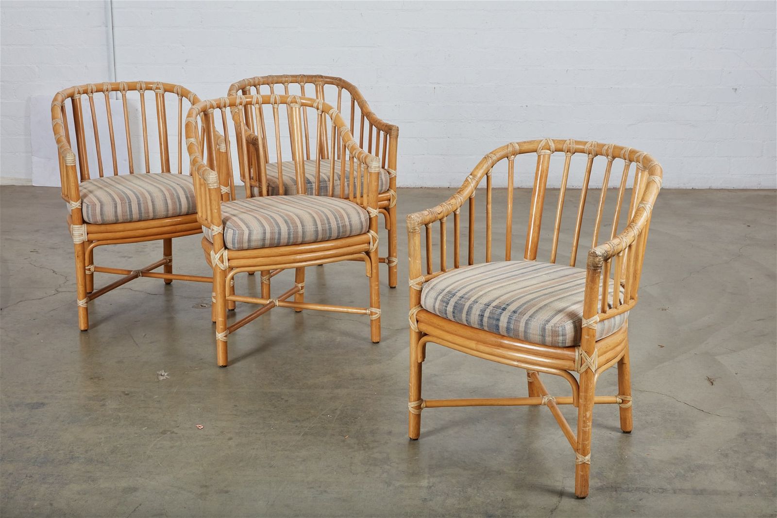A SET OF FOUR MCGUIRE RATTAN