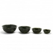 A SET OF FOUR NESTING CARVED S