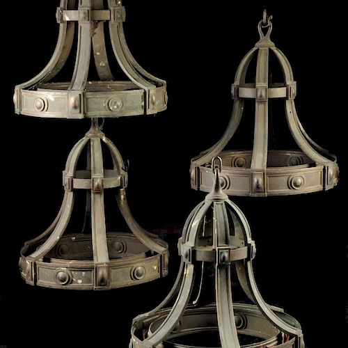 A SET OF FOUR PATINATED BRONZE