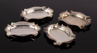 A set of four silver ashtrays, John