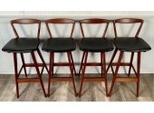 A set of four teak barstool wi