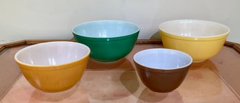 A set of four vintage pyrex round