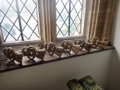 A SET OF SIX BRASS TASSEL PATT
