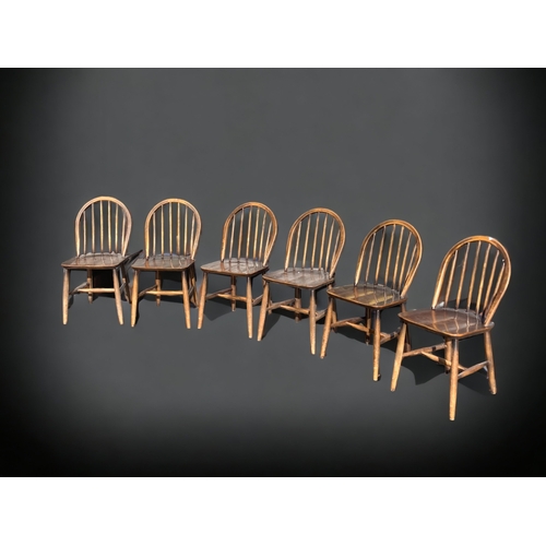 A SET OF SIX ERCOL STICK BACK
