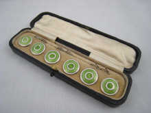 A set of six green and white