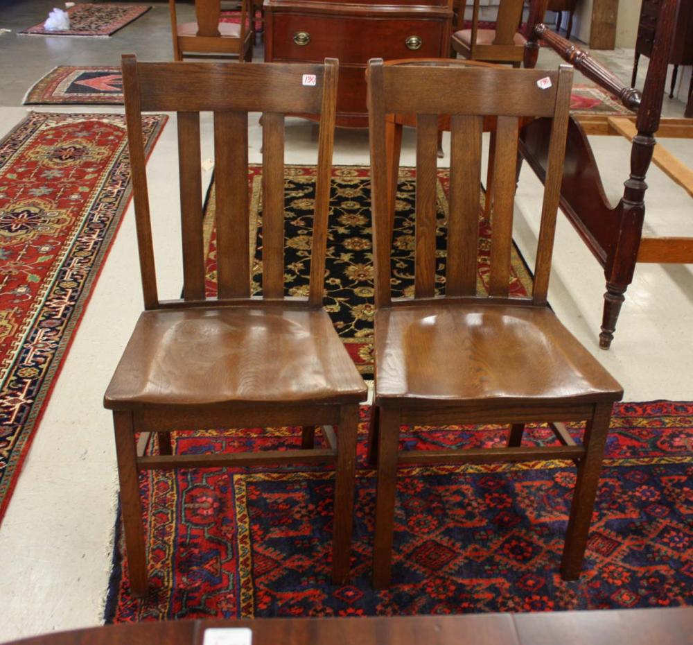 A SET OF SIX OAK DINING CHAIRS,
