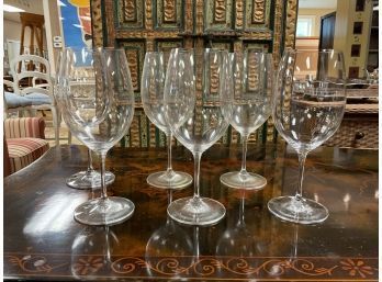 A set of six red wine glasses,