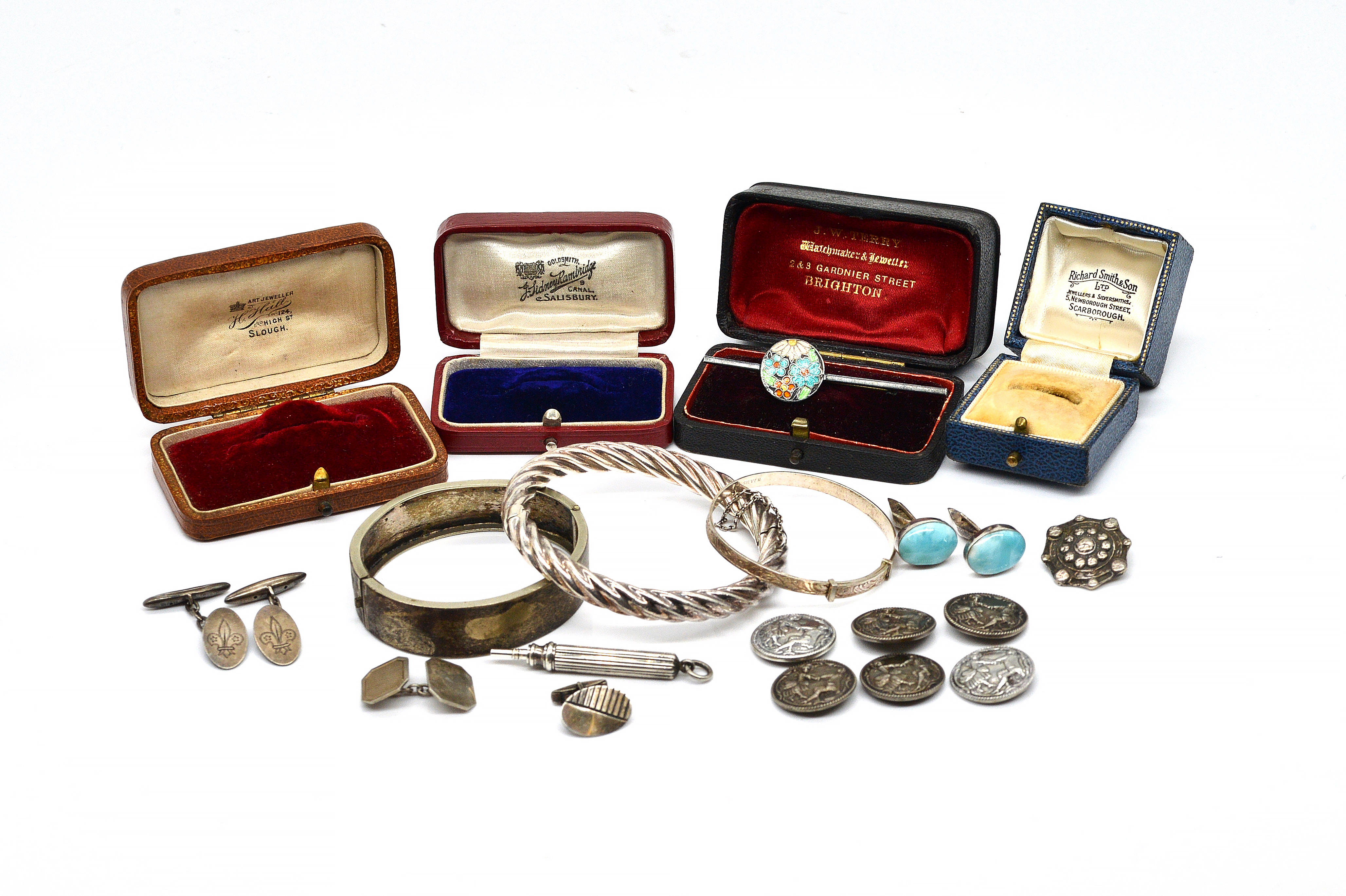 A SET OF SIX SILVER BUTTONS AND TEN