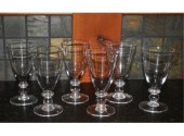 A set of six Simon Pearce sign