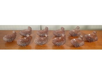 A set of ten purple and clear glass