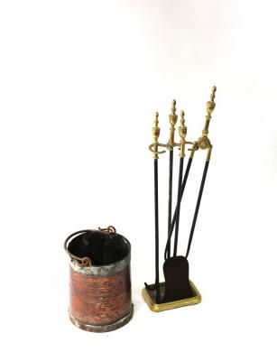 A set of three brass fire irons and