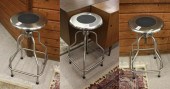 A SET OF THREE STAINLESS STEEL