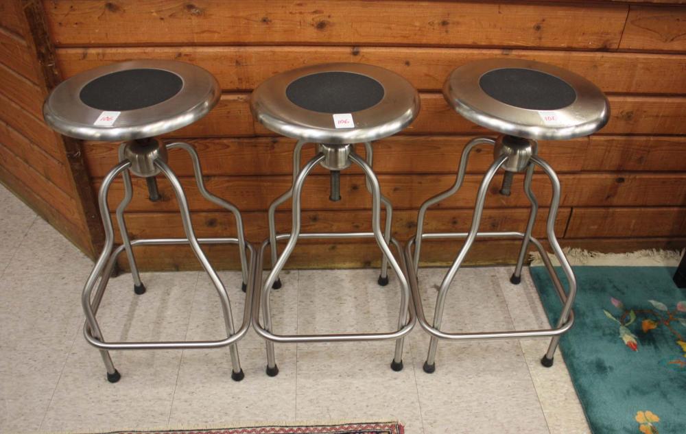 A SET OF THREE STAINLESS STEEL
