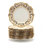 A SET OF TWELVE GOLD ENCRUSTED