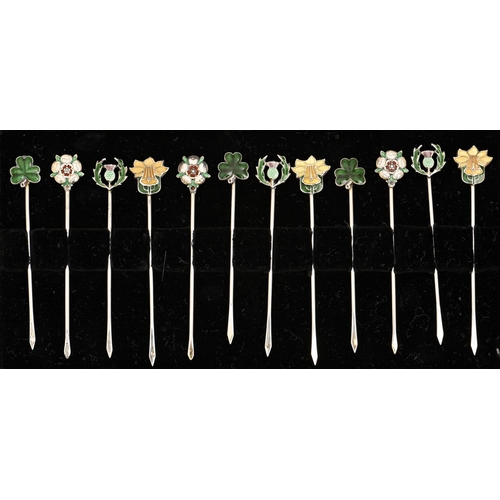 A set of twelve silver and enamel
