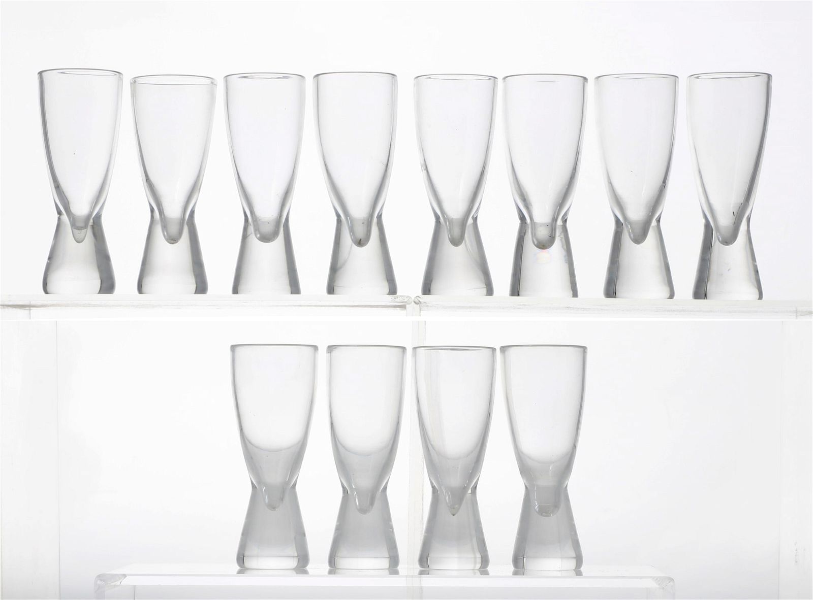 A SET OF TWELVE STEUBEN CLEAR GLASS