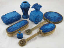 A seven piece blue glass dressing