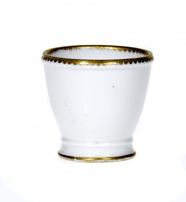 A SÈVRES EGG CUP with gilt dentil