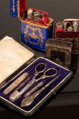 A sewing case, the silver