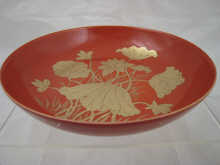 A shallow Chinese dish the pale red