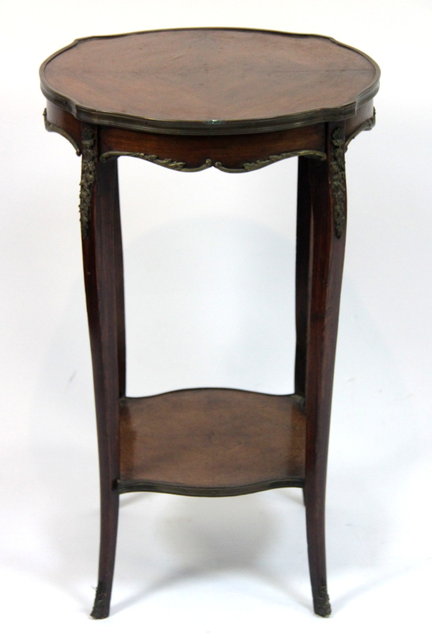 A shaped circular gilt mounted
