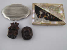 A shaped oval silver compact