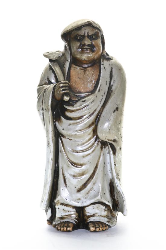 A Shiwan Clay Figure of a Daoist