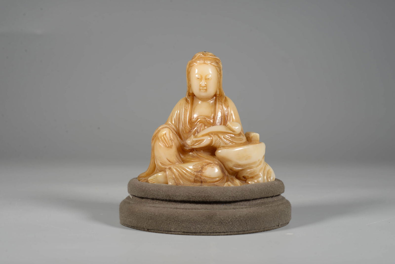 A SHOUSHAN STONE GUANYIN FIGUREA