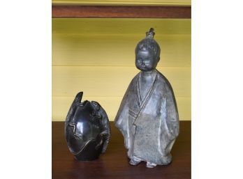 A signed figure of young boy in