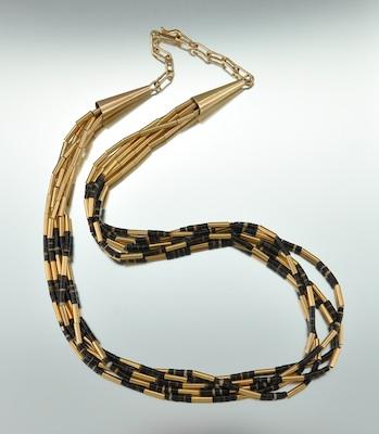 A Signed Horn Beads and 14k