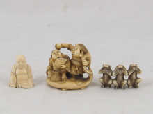 A signed ivory netsuke of two comic