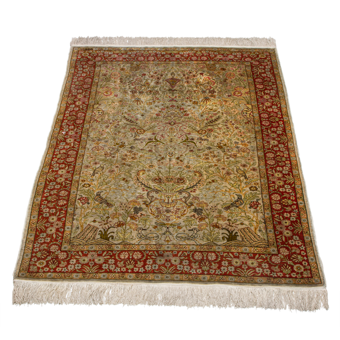 A SIGNED TURKISH HEREKE CARPET A