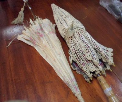 A silk parasol and another with