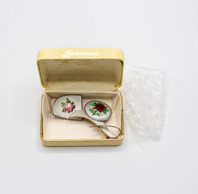 A silver and enamel brooch, JA & S,