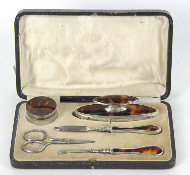 A silver and faux tortoiseshell