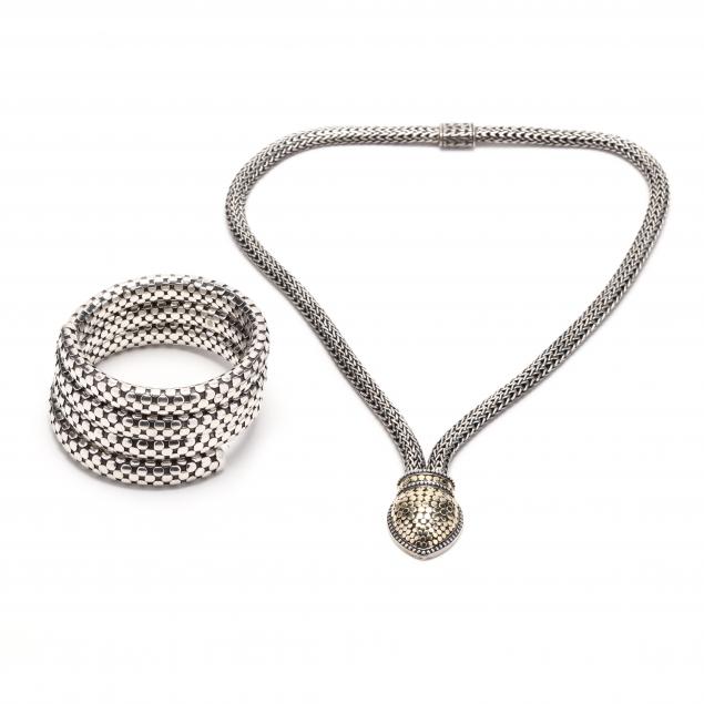 A SILVER AND GOLD NECKLACE BY