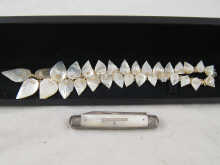 A silver and mother of pearl