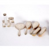 A silver backed dressing set,